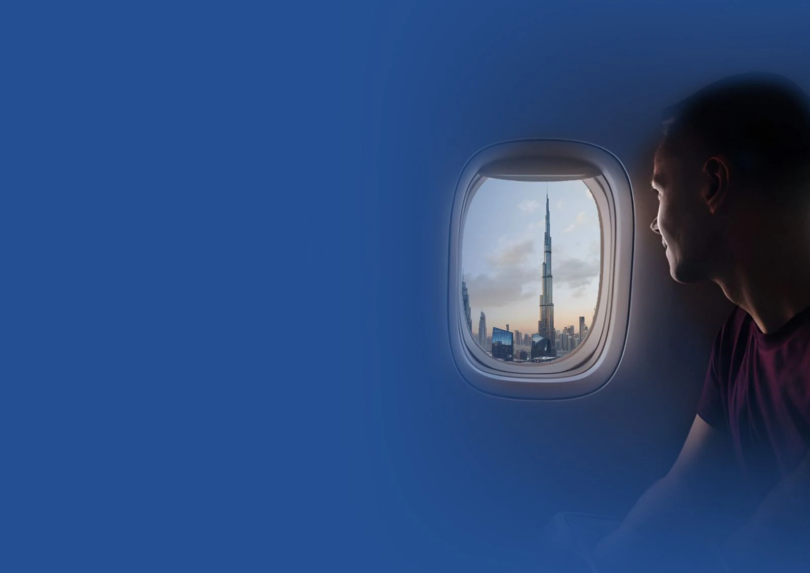 Passenger looking at Burj Khalifa from a plane window