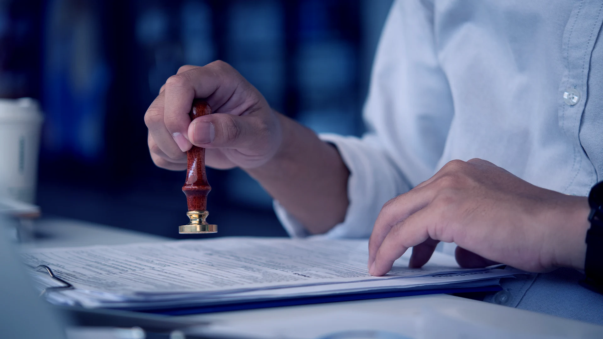 Notary sealing a signed legal document